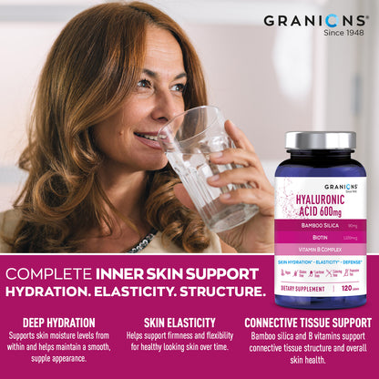 Woman holding a glass of water next to a Granions Hyaluronic Acid supplement bottle.